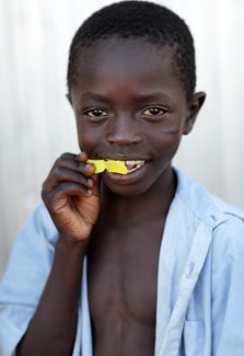 Boy Eating Lemon