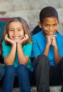 Children Sitting and Smiling