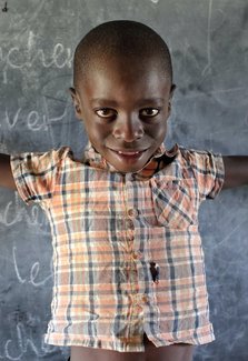 Child in front of Chalkboard