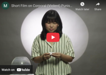 Image from video with women reading a message