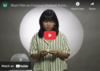 Image from video with women reading a message